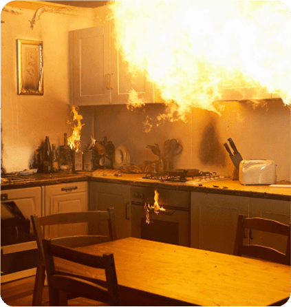 A kitchen with flames coming from the oven.